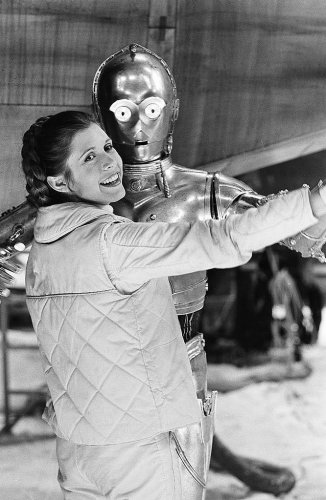 Carrie Fisher and Anthony Daniels dancing.jpg