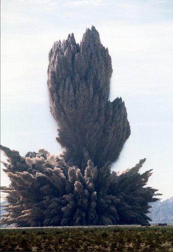 Smoke, dust and debris rise into the air as 3.jpg