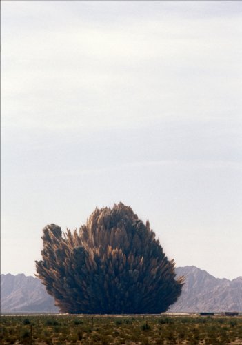 Smoke, dust and debris rise into the air as 3.jpg