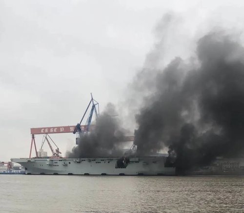 000ChinaType 075 LHD is on fire this morning at the Hudong-Zhonghua Shipyard in #Shanghai.jpg