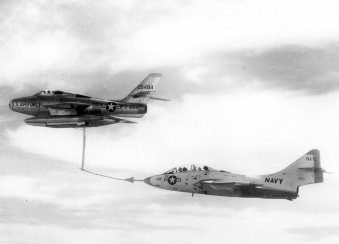 USAF F-84F (26484) refueling US Navy F9F-8T.jpg