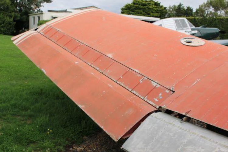 Ag-2 ABOVE WING SHOT OF AILERONS AND SLOT LIPS AND INBOARD FLAP PARTIAL VERY GOOD.png