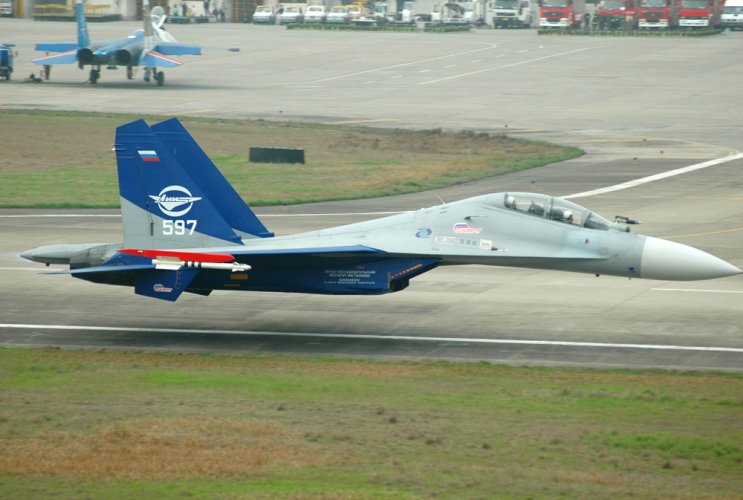 Sukhoi_Su-30LL_demonstrator_flying_along_the_runway_at_Zhangjiajie_Hehua_Airport_less_than_1_m...jpg