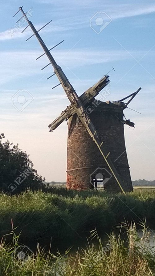 95220887-landscape-view-of-ancient-ruined-windmill-on-the-norfolk-broads-east-anglia-england-w...jpg