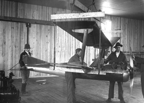 Workers moving a fully assembled Kettering “Bug”.jpg