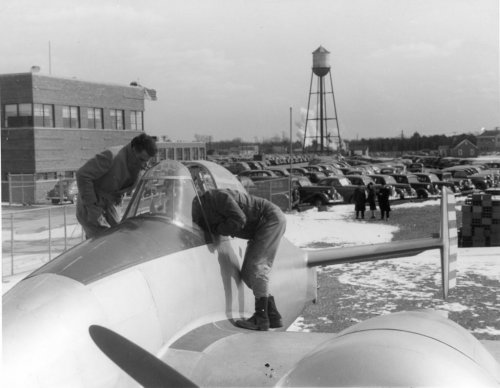 grum1274XP-50twomenlookingintocockp.jpg